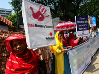 Bangladeshi garment workers and other labor organization members take part in a rally to mark May Day, International Workers' Day in Dhaka,...