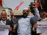 Palestinian labor activists chant slogans during a march for the International Labor Day at the Palestine square in Gaza City, May 1, 2018....