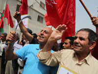 Palestinian labor activists chant slogans during a march for the International Labor Day at the Palestine square in Gaza City, May 1, 2018....