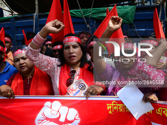 Bangladeshi garment workers and other labor organization members take part in a rally to mark May Day, International Workers' Day in Dhaka,...