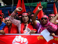 Bangladeshi garment workers and other labor organization members take part in a rally to mark May Day, International Workers' Day in Dhaka,...