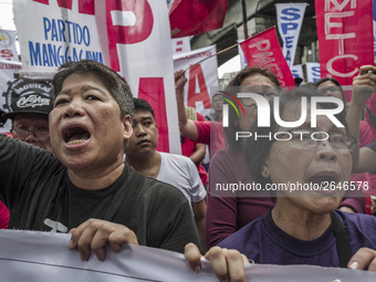 Workers shout slogans during labor day demonstrations outside the presidential palace in Manila, Philippines, May 1, 2018. Thousands of work...