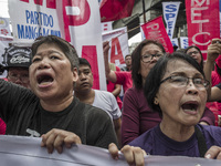 Workers shout slogans during labor day demonstrations outside the presidential palace in Manila, Philippines, May 1, 2018. Thousands of work...