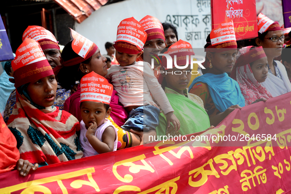 Bangladeshi garment workers and other labor organization members take part in a rally to mark May Day, International Workers' Day in Dhaka,...