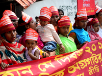 Bangladeshi garment workers and other labor organization members take part in a rally to mark May Day, International Workers' Day in Dhaka,...