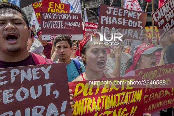 Workers shout slogans during labor day demonstrations outside the presidential palace in Manila, Philippines, May 1, 2018. Thousands of work...