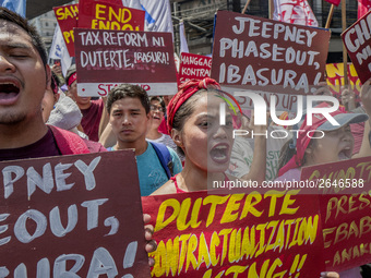 Workers shout slogans during labor day demonstrations outside the presidential palace in Manila, Philippines, May 1, 2018. Thousands of work...