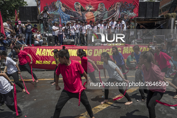 Workers perform as they take part in labor day demonstrations outside the presidential palace in Manila, Philippines, May 1, 2018. Thousands...