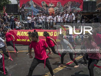 Workers perform as they take part in labor day demonstrations outside the presidential palace in Manila, Philippines, May 1, 2018. Thousands...