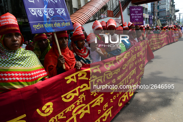 Bangladeshi garment workers and other labor organization members take part in a rally to mark May Day, International Workers' Day in Dhaka,...