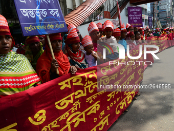 Bangladeshi garment workers and other labor organization members take part in a rally to mark May Day, International Workers' Day in Dhaka,...