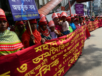 Bangladeshi garment workers and other labor organization members take part in a rally to mark May Day, International Workers' Day in Dhaka,...