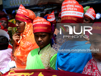 Bangladeshi garment workers and other labor organization members take part in a rally to mark May Day, International Workers' Day in Dhaka,...