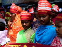 Bangladeshi garment workers and other labor organization members take part in a rally to mark May Day, International Workers' Day in Dhaka,...