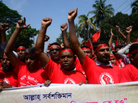 Bangladeshi garment workers and other labor organization members take part in a rally to mark May Day, International Workers' Day in Dhaka,...