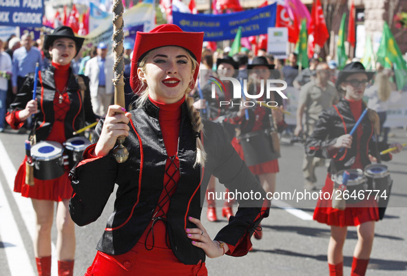 People hold red and green flags during a 1 May Day ( The International Labour Day) rally organised by the Ukrainian left-wing parties in Kie...