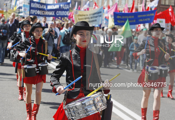 People hold red and green flags during a 1 May Day ( The International Labour Day) rally organised by the Ukrainian left-wing parties in Kie...