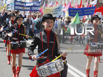 People hold red and green flags during a 1 May Day ( The International Labour Day) rally organised by the Ukrainian left-wing parties in Kie...