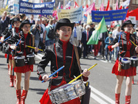 People hold red and green flags during a 1 May Day ( The International Labour Day) rally organised by the Ukrainian left-wing parties in Kie...