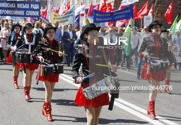 People hold red and green flags during a 1 May Day ( The International Labour Day) rally organised by the Ukrainian left-wing parties in Kie...