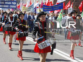 People hold red and green flags during a 1 May Day ( The International Labour Day) rally organised by the Ukrainian left-wing parties in Kie...