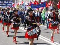 People hold red and green flags during a 1 May Day ( The International Labour Day) rally organised by the Ukrainian left-wing parties in Kie...