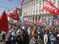 People hold red and green flags during a 1 May Day ( The International Labour Day) rally organised by the Ukrainian left-wing parties in Kie...