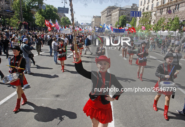 People hold red and green flags during a 1 May Day ( The International Labour Day) rally organised by the Ukrainian left-wing parties in Kie...