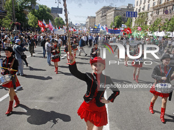 People hold red and green flags during a 1 May Day ( The International Labour Day) rally organised by the Ukrainian left-wing parties in Kie...