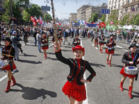 People hold red and green flags during a 1 May Day ( The International Labour Day) rally organised by the Ukrainian left-wing parties in Kie...