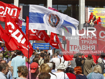 People hold red and green flags during a 1 May Day ( The International Labour Day) rally organised by the Ukrainian left-wing parties in Kie...