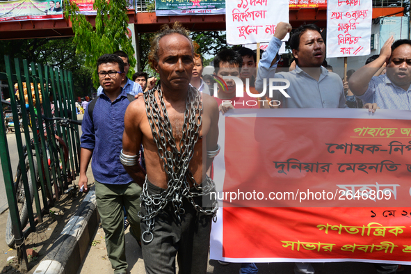 A Bangladeshi worker wears metal chain as he attends a May Day protest rally in Dhaka, Bangladesh on May 01, 2018. Thousands of workers of s...