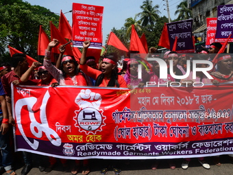 Bangladeshi garment workers and other labor organization members take part in a rally to mark May Day, International Workers' Day in Dhaka,...