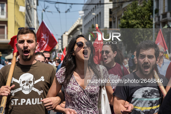 Protesters shout slogans during a rally commemorating May Day in Athens, Greece May 1, 2018. 