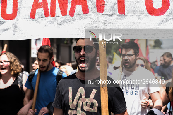 Protesters shout slogans during a rally commemorating May Day in Athens, Greece May 1, 2018. 