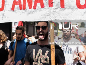 Protesters shout slogans during a rally commemorating May Day in Athens, Greece May 1, 2018. (