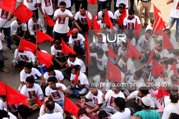 Bangladeshi garment workers and other labor organization members take part in a rally to mark May Day, International Workers' Day in Dhaka,...