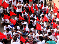 Bangladeshi garment workers and other labor organization members take part in a rally to mark May Day, International Workers' Day in Dhaka,...