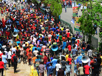 Bangladeshi garment workers and other labor organization members take part in a rally to mark May Day, International Workers' Day in Dhaka,...