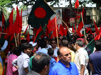 Bangladeshi garment workers and other labor organization members take part in a rally to mark May Day, International Workers' Day in Dhaka,...