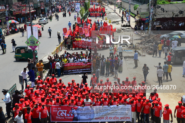 Bangladeshi garment workers and other labor organization members take part in a rally to mark May Day, International Workers' Day in Dhaka,...