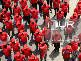 Bangladeshi garment workers and other labor organization members take part in a rally to mark May Day, International Workers' Day in Dhaka,...