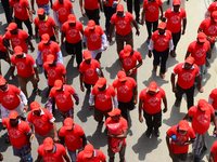 Bangladeshi garment workers and other labor organization members take part in a rally to mark May Day, International Workers' Day in Dhaka,...