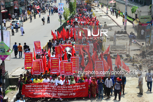 Bangladeshi garment workers and other labor organization members take part in a rally to mark May Day, International Workers' Day in Dhaka,...