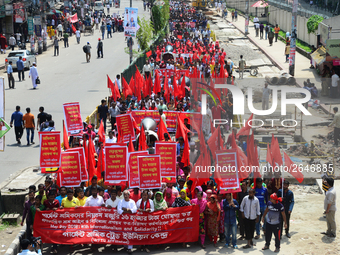 Bangladeshi garment workers and other labor organization members take part in a rally to mark May Day, International Workers' Day in Dhaka,...