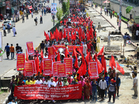 Bangladeshi garment workers and other labor organization members take part in a rally to mark May Day, International Workers' Day in Dhaka,...