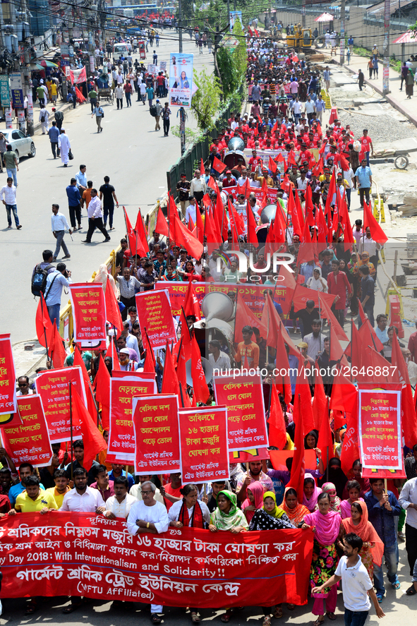 Bangladeshi garment workers and other labor organization members take part in a rally to mark May Day, International Workers' Day in Dhaka,...