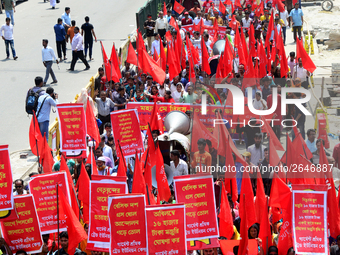 Bangladeshi garment workers and other labor organization members take part in a rally to mark May Day, International Workers' Day in Dhaka,...