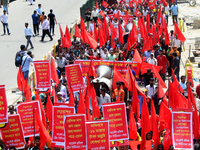 Bangladeshi garment workers and other labor organization members take part in a rally to mark May Day, International Workers' Day in Dhaka,...