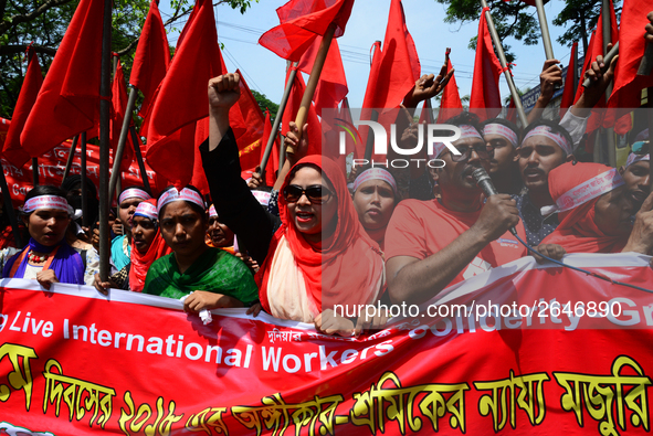 Bangladeshi garment workers and other labor organization members take part in a rally to mark May Day, International Workers' Day in Dhaka,...